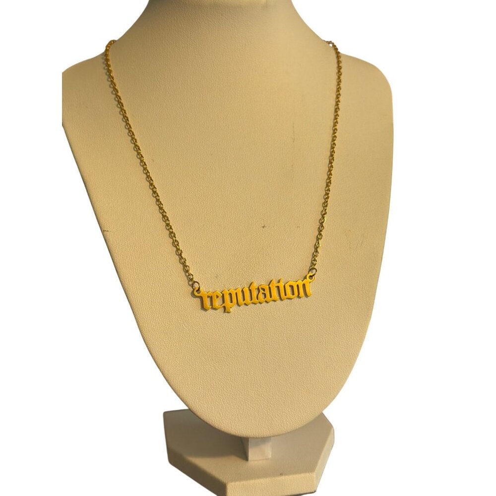 Gold Tone Reputation Taylor Script Script Pendant… - image 1